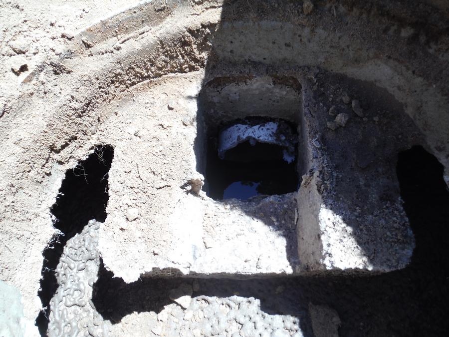 Cement exit baffle in septic tank